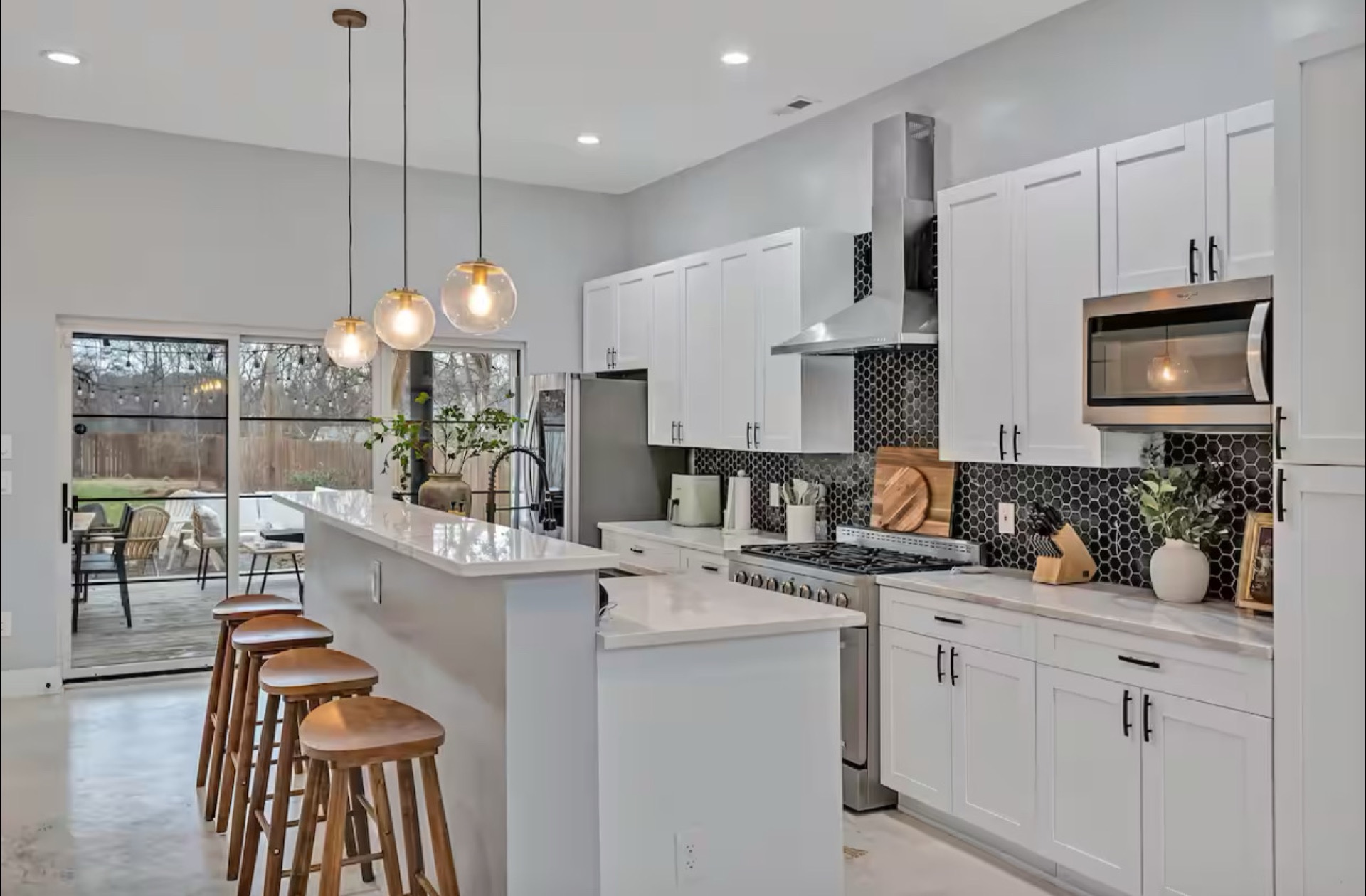 Open Raleigh kitchen with deck view — the kind of space short-term rental guests respond well to